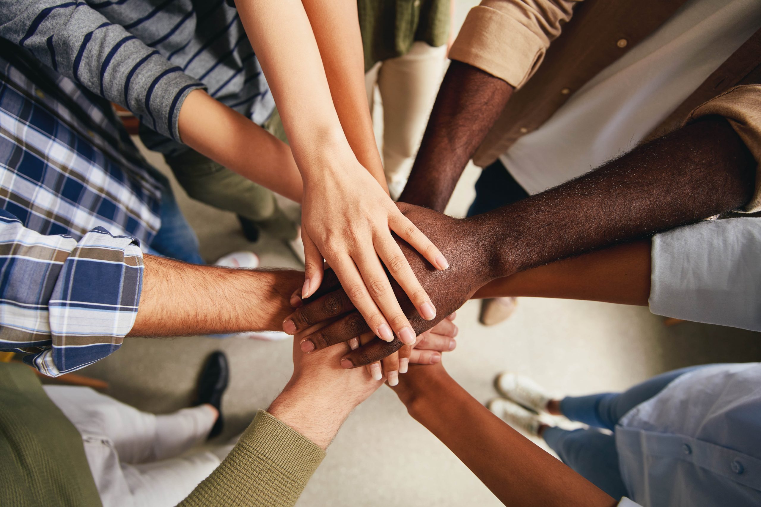 Team Members joining hands